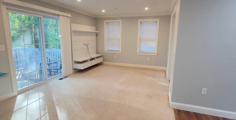 alt view of living room with sliding doors to deck